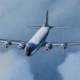 A detail from the Stan Stokes painting "History of Air Force One" showing the VC-118A Liftmaster used to carry the President to airfields that were not suitable for the jet aircraft